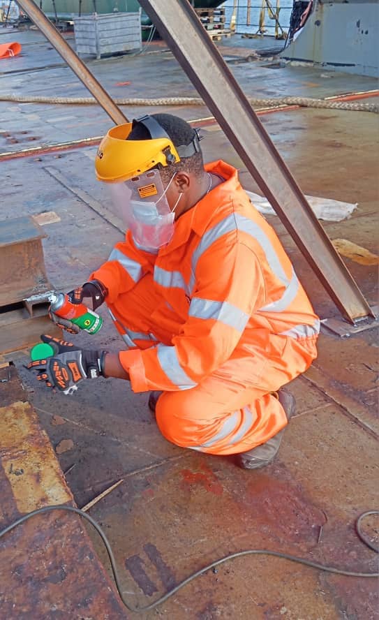 Dye penetrant inspection on a vessel deck